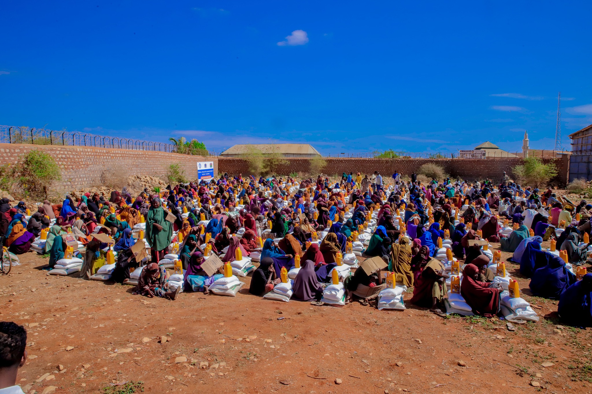 Somali Disaster Management Agency (SoDMA) officials distribute emergency food aid to vulnerable families in Baidoa on Tuesday, April 7, amid ongoing drought conditions.