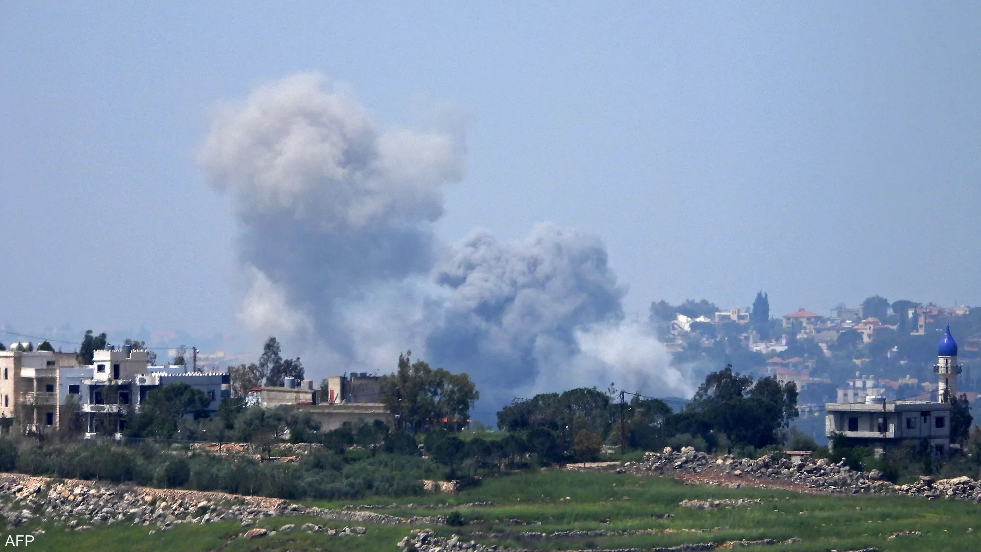 Smoke rises from a destroyed building in southern Lebanon following reported Israeli airstrikes that caused widespread damage and civilian casualties in the area.
