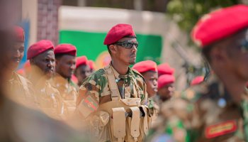 A Somali National Army soldier stands in formation with fellow troops during a military gathering in Mogadishu. Government forces have stepped up operations targeting Al-Shabaab militants.