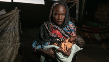 Displaced Sudanese families gather at a temporary shelter in Khartoum as the UN warns that nearly 70 percent of the population now lives in poverty amid the ongoing conflict between the army and RSF.