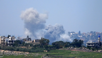 Smoke rises from a destroyed building in southern Lebanon following reported Israeli airstrikes that caused widespread damage and civilian casualties in the area.