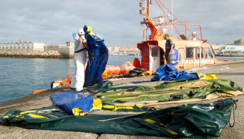 Spanish police officers during an operation targeting a migrant-smuggling network accused of arranging boat crossings from Ceuta to mainland Spain across the Strait of Gibraltar.